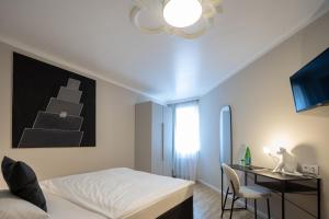 Katil atau katil-katil dalam bilik di Q! Hotel Maria Theresia
