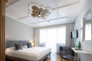 Katil atau katil-katil dalam bilik di Q! Hotel Maria Theresia