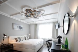 Katil atau katil-katil dalam bilik di Q! Hotel Maria Theresia