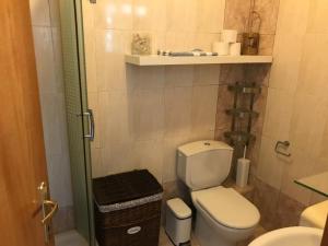a small bathroom with a toilet and a sink at Kali Stalonia in Nikiti +51 photos