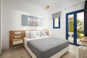 Postel nebo postele na pokoji v ubytování Artemis Apartments