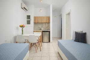 Postel nebo postele na pokoji v ubytování Artemis Apartments