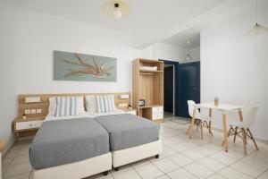 Postel nebo postele na pokoji v ubytování Artemis Apartments