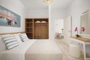 Postel nebo postele na pokoji v ubytování Artemis Apartments