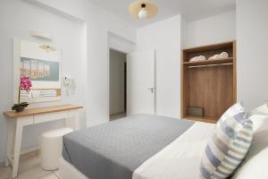 Postel nebo postele na pokoji v ubytování Artemis Apartments