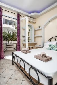 Posteľ alebo postele v izbe v ubytovaní Lefkes Studios