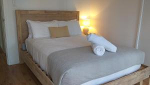 a bedroom with a large bed with two pillows at Riverslea Retreat in Margaret River Town +6 photos