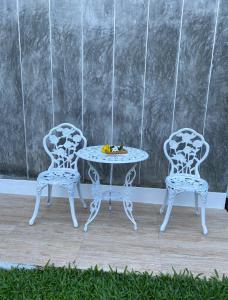 two chairs and a table and a table and chairs at Green Tree Cottage 4 in Klong Muang Beach +22 photos