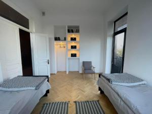 Postel nebo postele na pokoji v ubytování Twins Guest House