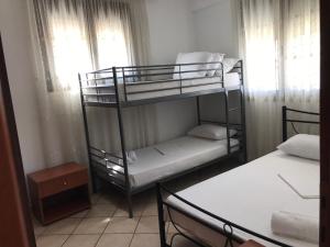 a room with two bunk beds and a window at Kali Stalonia in Nikiti