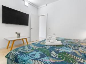 Ένα ή περισσότερα κρεβάτια σε δωμάτιο στο Olas y Mar Apartamentos