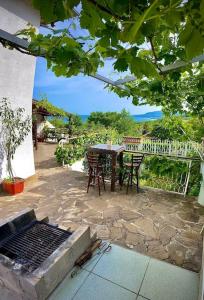 a patio with a table and chairs and a fence at Villa MAKA - Balchik, Albena Village Zone in Balchik