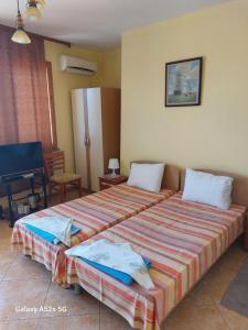 Postel nebo postele na pokoji v ubytování Homestay Kostadinov