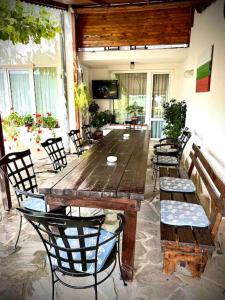 a large wooden table and chairs on a patio at Villa MAKA - Balchik, Albena Village Zone in Balchik