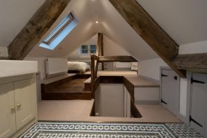 a kitchen with stairs and a bed in a room at Cosy Country Townhouse in Woodstock in Woodstock