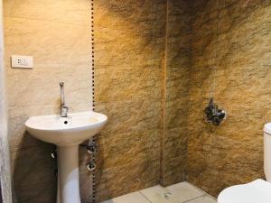 a bathroom with a sink and a toilet at OH! Cairo Pharaoh Hostel in Cairo