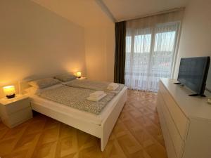 Ένα ή περισσότερα κρεβάτια σε δωμάτιο στο Apartman Dragovic
