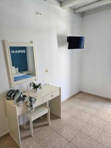 TV a/nebo společenská místnost v ubytování Faros Rooms