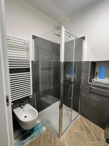a bathroom with a shower and a sink at Casa Amelia in Nesso +22 photos