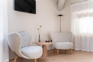 TV a/nebo společenská místnost v ubytování Hotel Al Maso