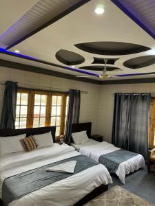 Una cama o camas en una habitación de Signature Skardu Hotel