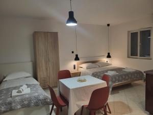Postel nebo postele na pokoji v ubytování Batkoski Apartments