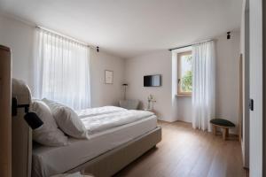 Postel nebo postele na pokoji v ubytování Hotel Al Maso