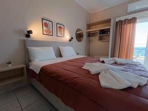 Postel nebo postele na pokoji v ubytování Faros Apartments
