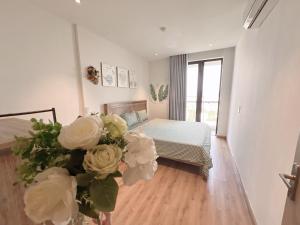 Ένα ή περισσότερα κρεβάτια σε δωμάτιο στο Maya'homes-Căn hộ view Vịnh Hạ Long +5 φωτογραφίες