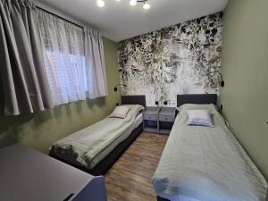 Postel nebo postele na pokoji v ubytování Pańska Izba