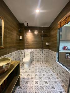a bathroom with a toilet and a sink at An Thuong House - Hoan Kiem, Hanoi Center in Hanoi +80 photos