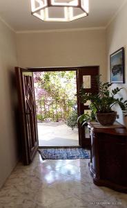 an open door with a potted plant in a room at Vila Maljevik in Sutomore +36 photos