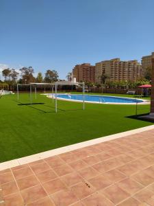 Bazén v ubytování Disfruta Torremar - segunda línea playa nebo v jeho okolí
