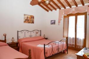 Łóżko lub łóżka w pokoju w obiekcie Agriturismo "La Fraschetta"