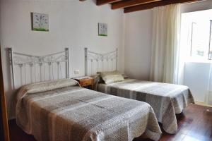 Ένα ή περισσότερα κρεβάτια σε δωμάτιο στο Casa Pepa de Enrique