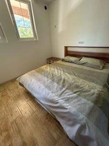 Postel nebo postele na pokoji v ubytování Apartmani Petkovic + 4 fotografie