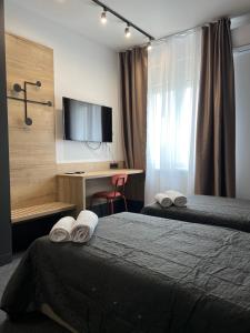 Ένα ή περισσότερα κρεβάτια σε δωμάτιο στο Sremsky inn