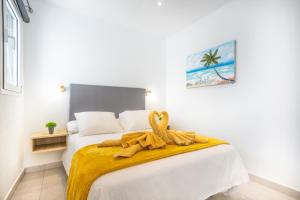 En eller flere senge i et værelse på Villa Deseo Puerto Del Carmen