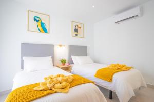 En eller flere senge i et værelse på Villa Deseo Puerto Del Carmen