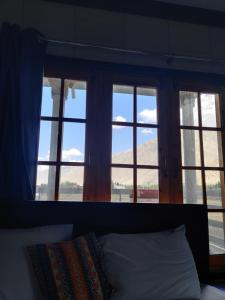Una cama o camas en una habitación de Signature Skardu Hotel