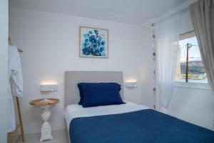 Postel nebo postele na pokoji v ubytování Coconut Blue