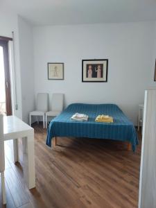 Un pat sau paturi într-o cameră la A Casa di Vale