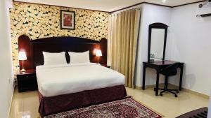 Postel nebo postele na pokoji v ubytování Star Dahlia Hotel