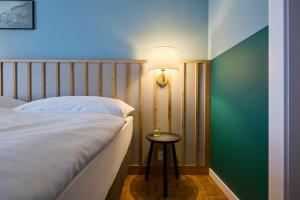 Łóżko lub łóżka w pokoju w obiekcie Hotel Limmathof