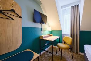 Telewizja i/lub zestaw kina domowego w obiekcie Hotel Limmathof