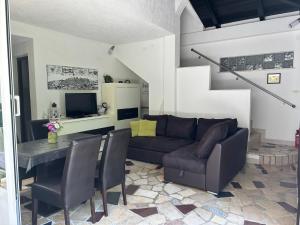 a living room with a couch and a table at Haus Karin in Lovran