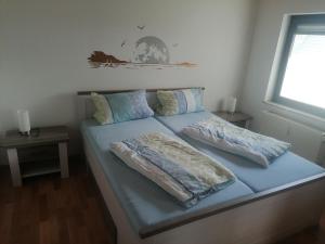 Postel nebo postele na pokoji v ubytování Ferienwohnung Moselhöhe