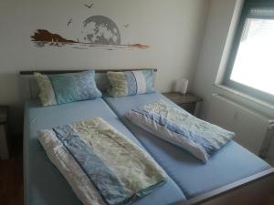 Postel nebo postele na pokoji v ubytování Ferienwohnung Moselhöhe
