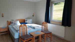Postel nebo postele na pokoji v ubytování Haus Ellbrunn