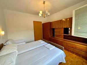 Postel nebo postele na pokoji v ubytování APARTMAN NENO